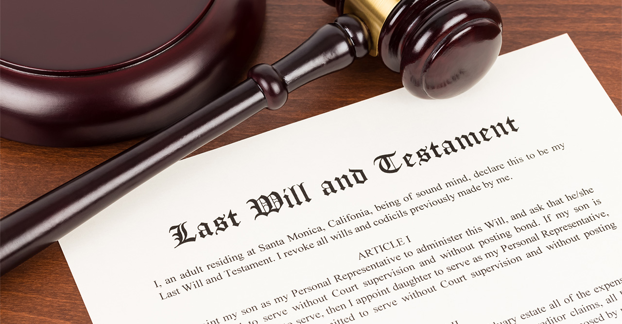 last will and testament on yellowish paper with wooden judge gavel