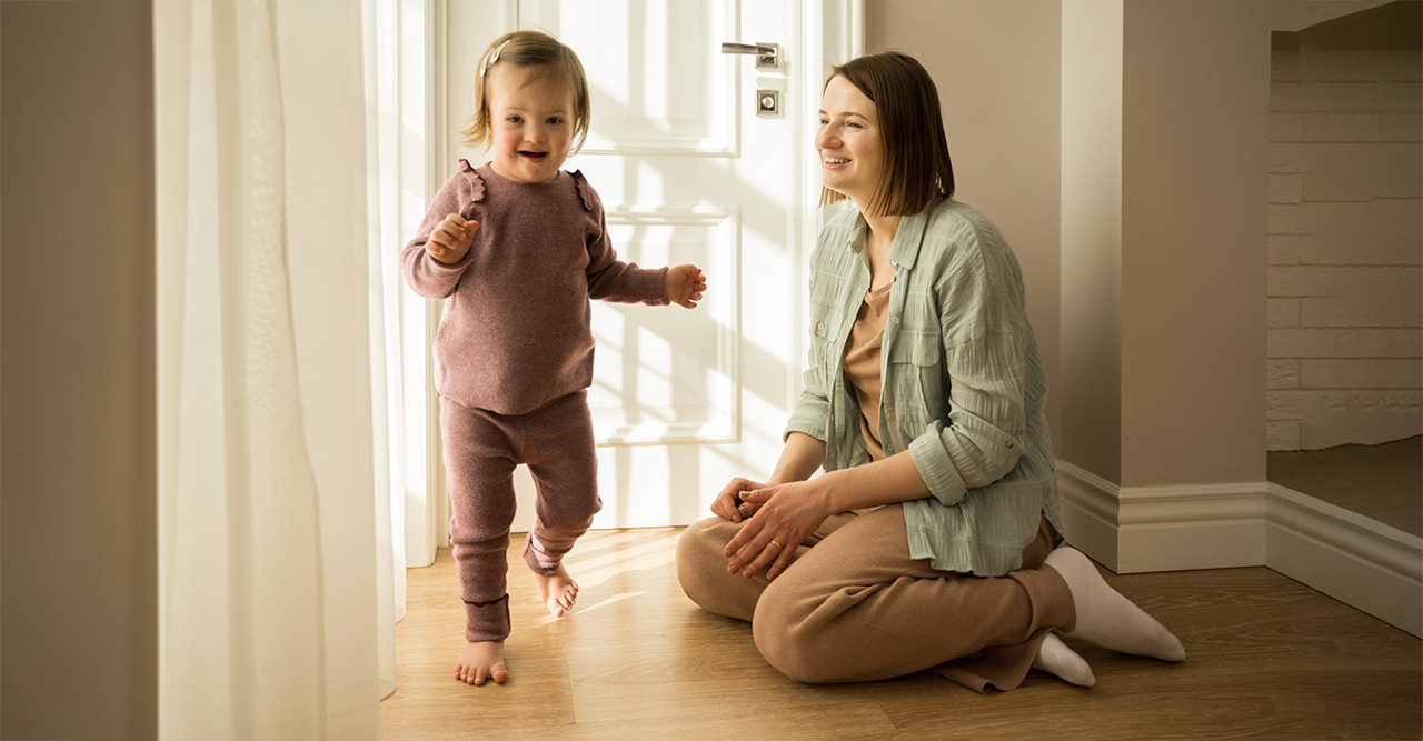 mother playing with her daughter with down syndrome