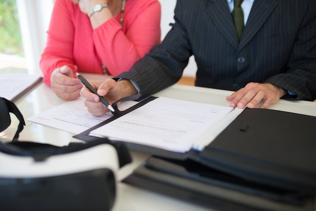 two people looking at documents