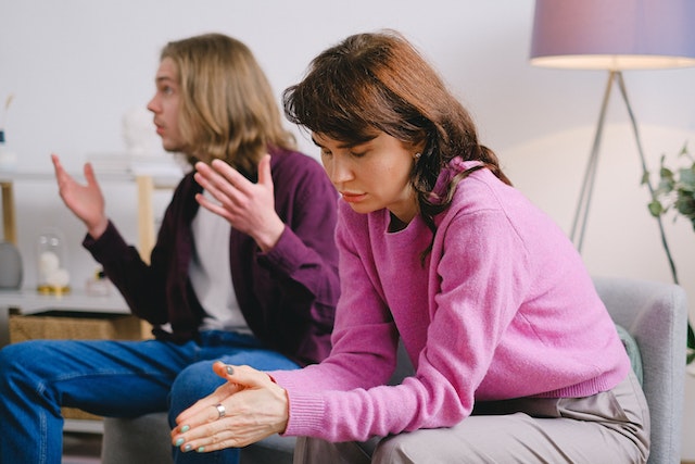 people on couch fighting