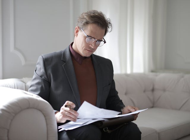 man looking at documents