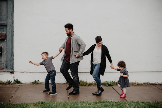 family of four walking