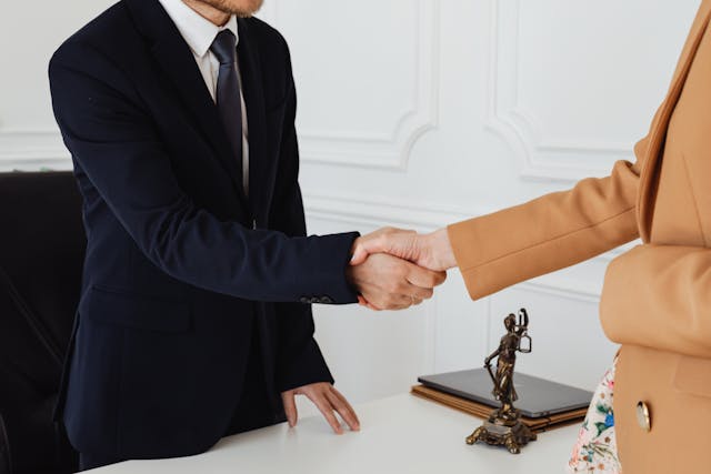people in law office shaking hands