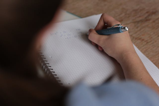 woman writing documents