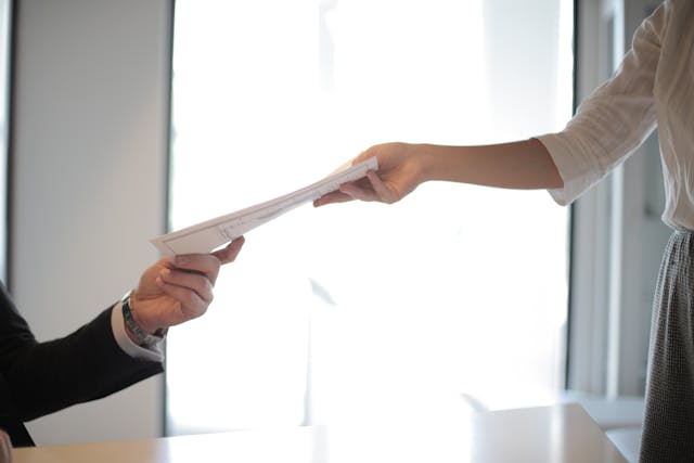 people exchanging documents