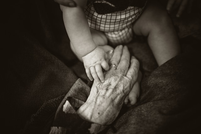 baby and elderly hands